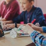 Stem education. Kids creating robots at school